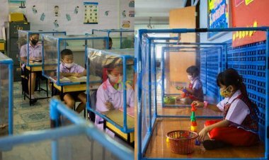 यहां बच्चे प्लास्टिक प्रोटेक्टिव स्क्रीन के अंदर कैद होकर पढ़ाई कर रहे हैं, तस्वीरों में देखिए स्कूल के सख्त नियम।